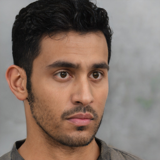 Neutral latino young-adult male with short  brown hair and brown eyes