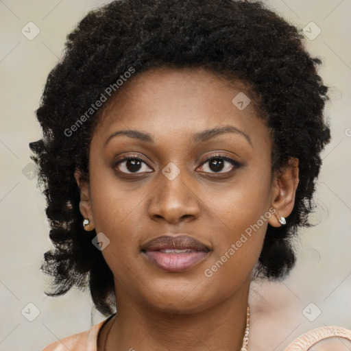 Joyful black young-adult female with long  brown hair and brown eyes