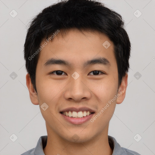 Joyful asian young-adult male with short  black hair and brown eyes