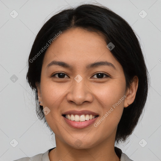 Joyful asian young-adult female with medium  black hair and brown eyes