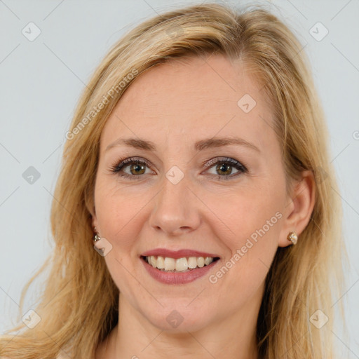 Joyful white adult female with long  brown hair and brown eyes