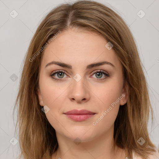 Joyful white young-adult female with long  brown hair and green eyes