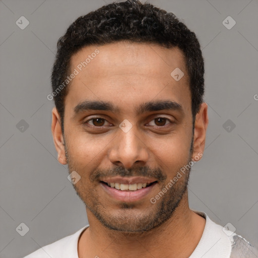 Joyful latino young-adult male with short  black hair and brown eyes