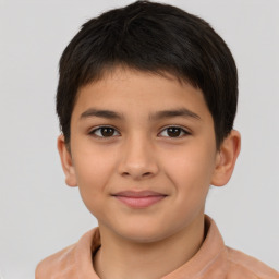 Joyful white child male with short  brown hair and brown eyes