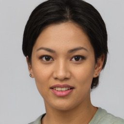 Joyful asian young-adult female with short  black hair and brown eyes