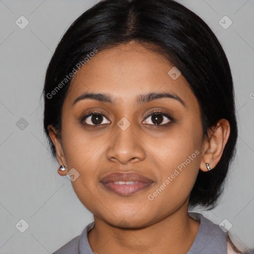 Joyful black young-adult female with medium  black hair and brown eyes