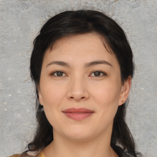 Joyful asian young-adult female with medium  black hair and brown eyes