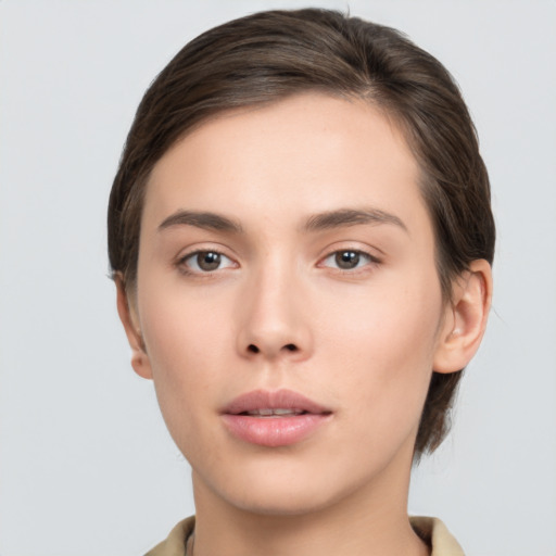 Neutral white young-adult female with short  brown hair and brown eyes