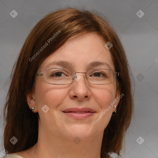 Joyful white adult female with medium  brown hair and blue eyes