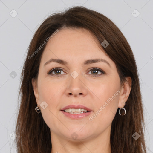 Joyful white adult female with long  brown hair and brown eyes