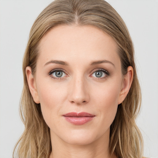 Joyful white young-adult female with long  brown hair and blue eyes