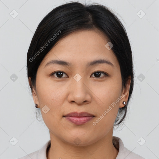 Joyful asian young-adult female with medium  brown hair and brown eyes