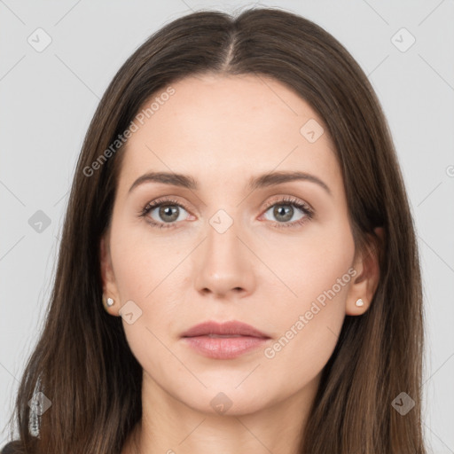 Neutral white young-adult female with long  brown hair and brown eyes