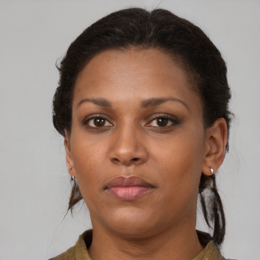 Neutral black young-adult female with long  brown hair and brown eyes