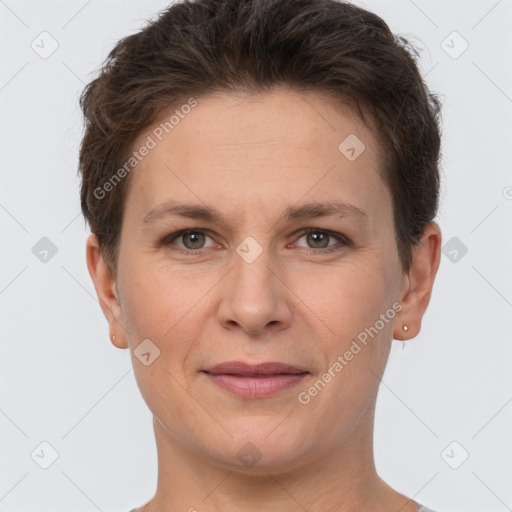 Joyful white adult female with short  brown hair and brown eyes