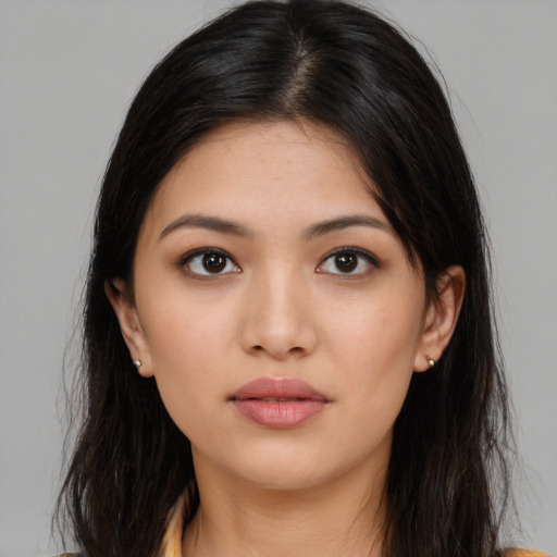 Neutral latino young-adult female with long  brown hair and brown eyes