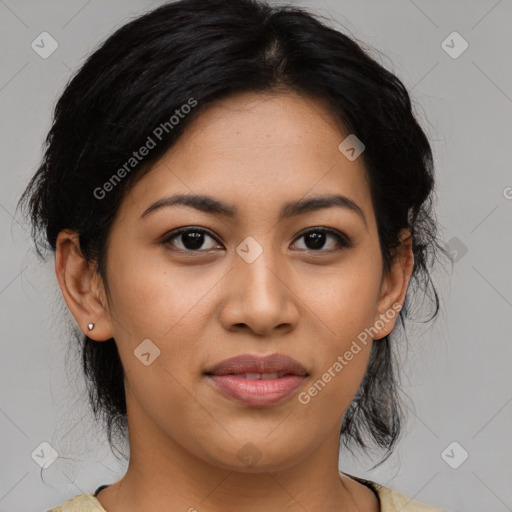 Joyful latino young-adult female with medium  brown hair and brown eyes