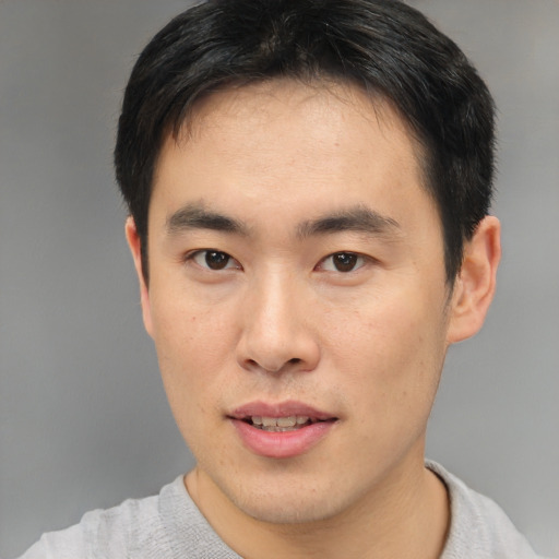 Neutral asian young-adult male with short  brown hair and brown eyes