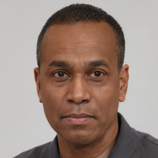 Neutral black adult male with short  black hair and brown eyes