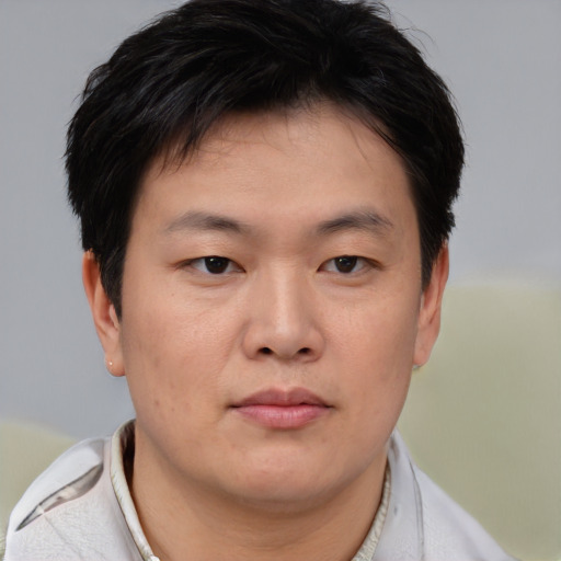 Neutral asian young-adult male with short  brown hair and brown eyes