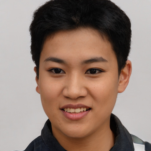 Joyful asian young-adult female with short  black hair and brown eyes