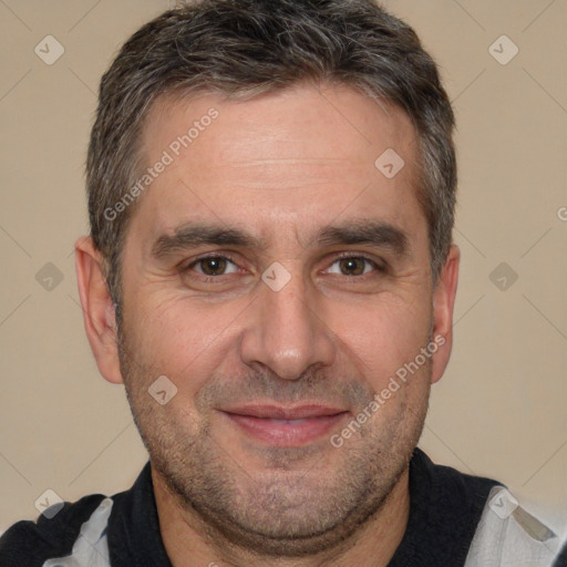 Joyful white adult male with short  brown hair and brown eyes