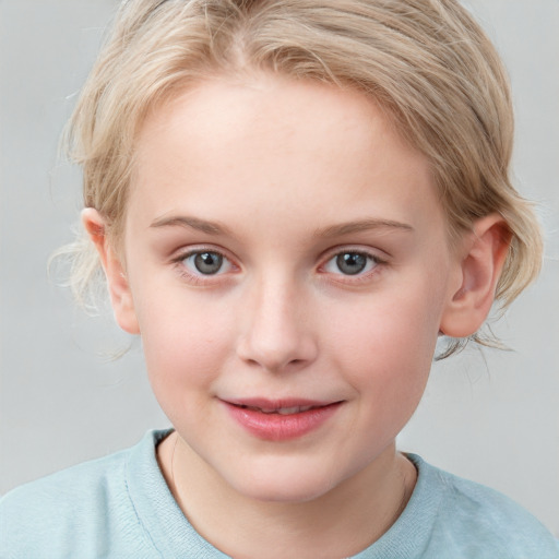 Joyful white child female with medium  brown hair and blue eyes