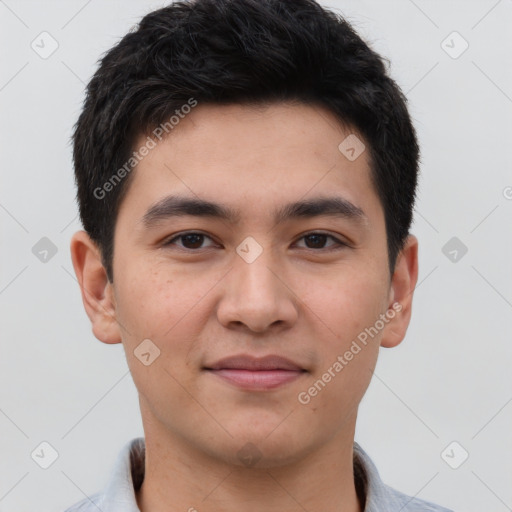 Joyful latino young-adult male with short  brown hair and brown eyes