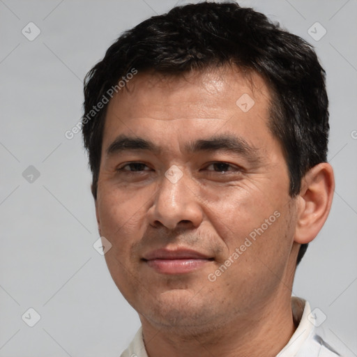 Joyful white adult male with short  brown hair and brown eyes