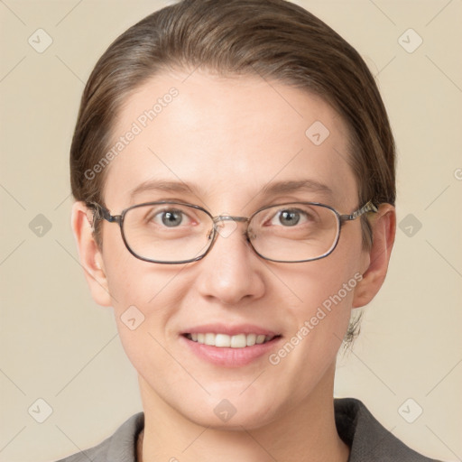 Joyful white young-adult female with short  brown hair and grey eyes