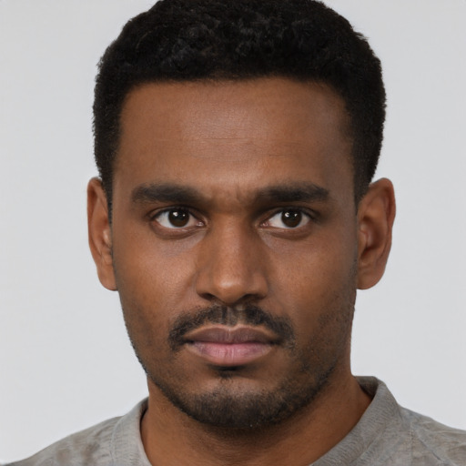 Neutral black young-adult male with short  black hair and brown eyes