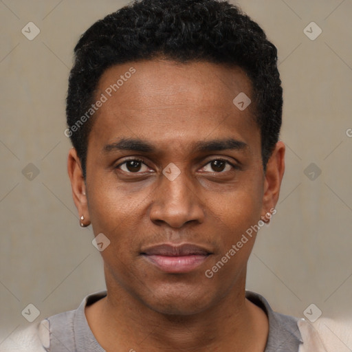 Joyful black young-adult male with short  black hair and brown eyes