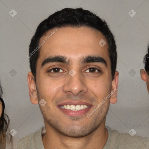 Joyful white young-adult male with short  black hair and brown eyes