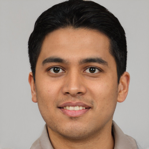 Joyful asian young-adult male with short  brown hair and brown eyes