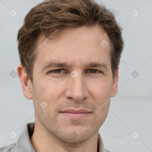 Joyful white adult male with short  brown hair and grey eyes