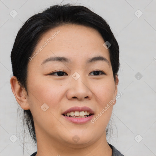 Joyful asian young-adult female with short  black hair and brown eyes