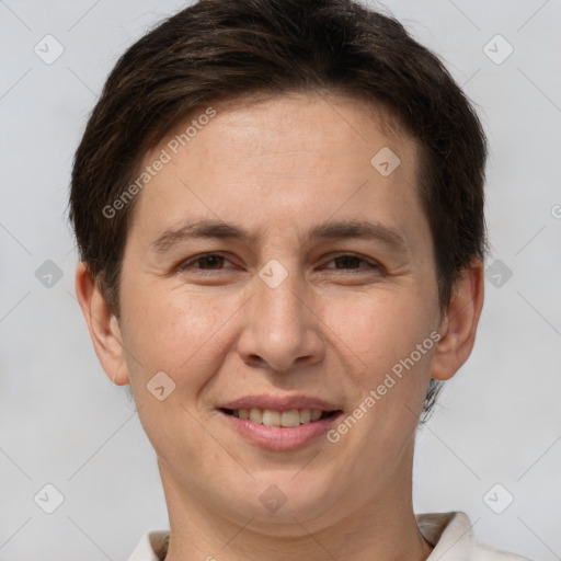 Joyful white adult female with short  brown hair and brown eyes