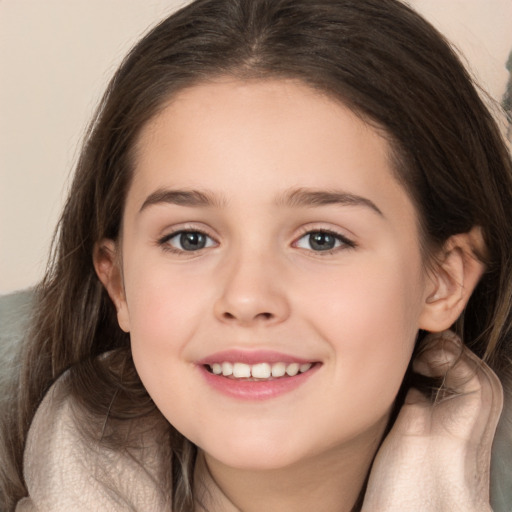 Joyful white child female with long  brown hair and brown eyes