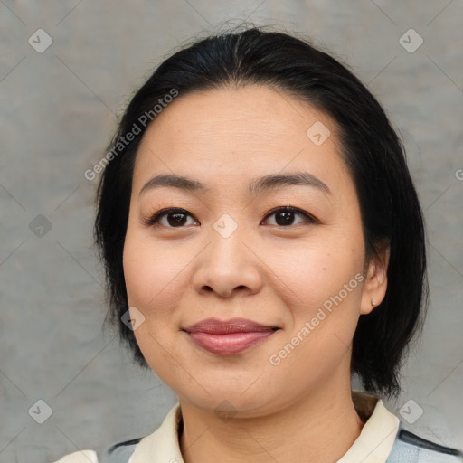 Joyful asian young-adult female with medium  black hair and brown eyes