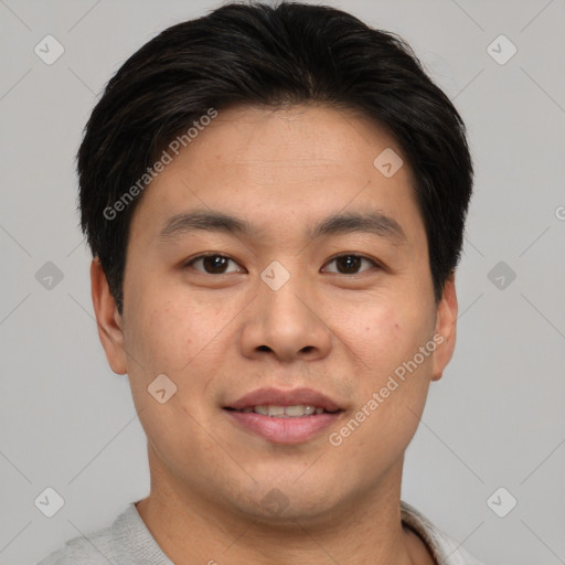 Joyful asian young-adult male with short  brown hair and brown eyes