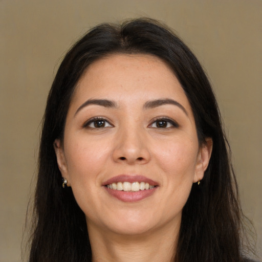 Joyful white young-adult female with long  brown hair and brown eyes