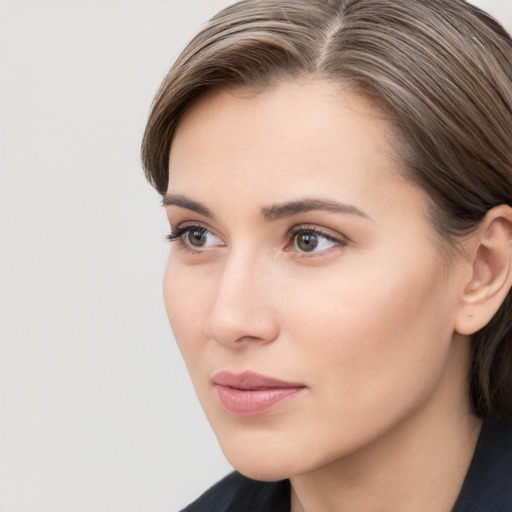 Neutral white young-adult female with medium  brown hair and brown eyes