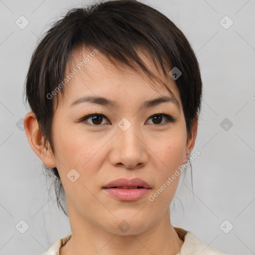 Joyful asian young-adult female with medium  brown hair and brown eyes