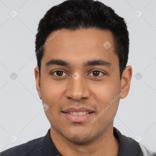 Joyful latino young-adult male with short  black hair and brown eyes