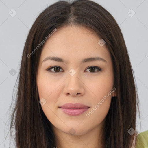 Joyful asian young-adult female with long  brown hair and brown eyes