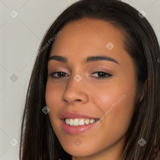 Joyful latino young-adult female with long  brown hair and brown eyes