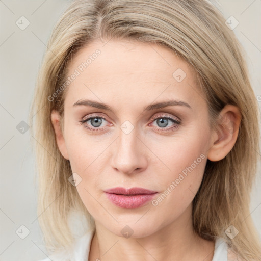 Joyful white young-adult female with medium  brown hair and blue eyes