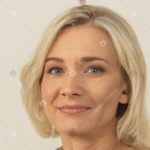 Joyful white adult female with medium  brown hair and green eyes