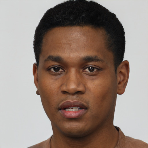 Neutral black young-adult male with short  black hair and brown eyes