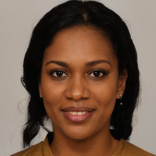 Joyful black young-adult female with medium  black hair and brown eyes